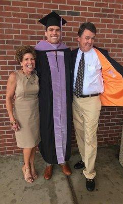 Third generation dentist, Dr. Taylor Reed with his parents on graduation day.