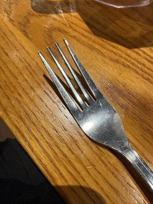 Food stuck in fork.