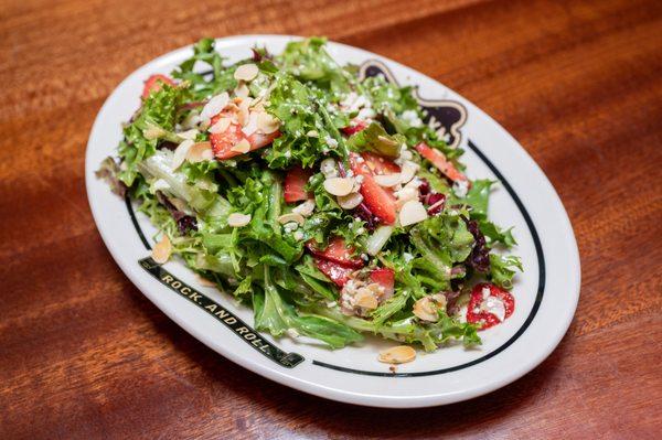 Strawberry Fields Salad: Strawberries, blue cheese + toasted almonds with balsamic dressing.