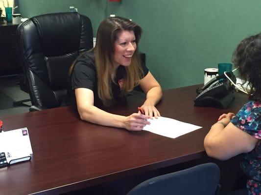 Here is our Office Manager, Christine sharing a laugh with a client as they finish up the paperwork.