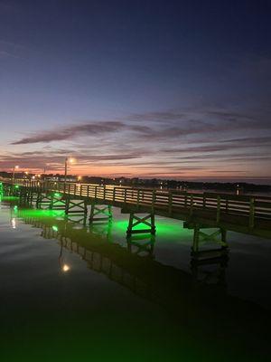 The pier all lit up at sunset