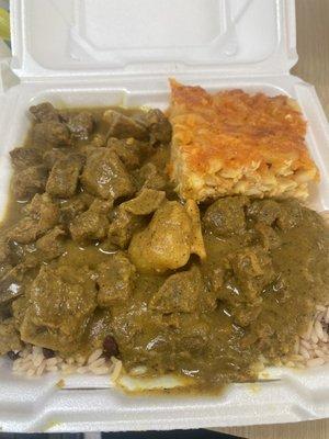 Curry Goat , Rice and Peas , Macaroni and Cheese