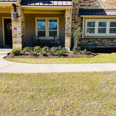 Trimmed all landscape, planted new plantings, mulched beds, & fixed sprinkler system.