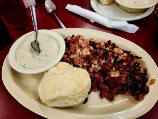 Corned beef hash with biscuit and gravy.