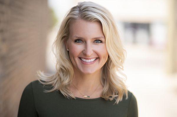 Outdoor headshot of a young woman