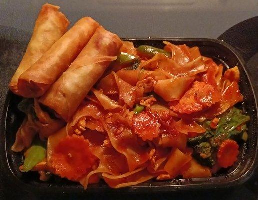 Veggie Egg Rolls and Pad Kee Mow: flat noodles, broccoli, Chinese broccoli, carrots, bell peppers, onions, and basil with chili sauce.