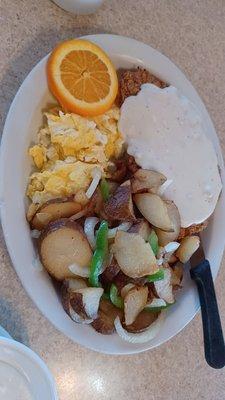 Chicken fried steak, eggs and home fries.