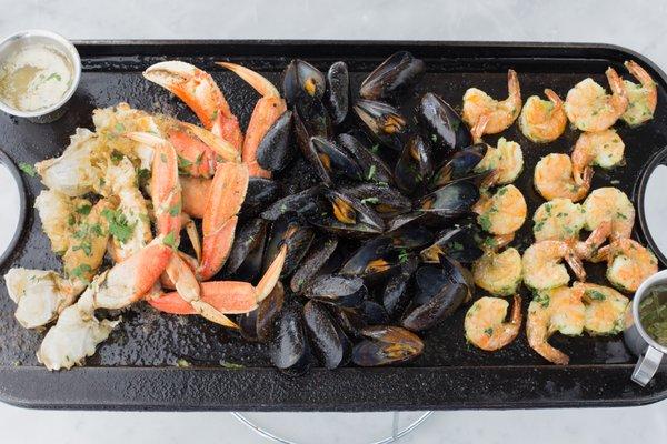 Sizzling Iron Skillet Roasted Super Combo Mussels, Shrimp and Dungeness Crab