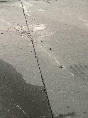 The damage concrete caused by the motor coach.