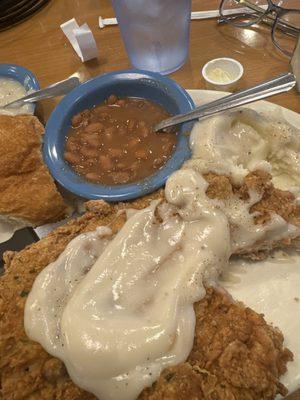 Senior Pork Chops ( fried) , potatoes , pinto beans  and plenty cream gravy !! And what a deal 9.99