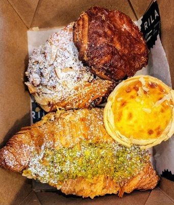 CC's pastry box w/almond croissant, kougin amann, Portuguese egg tart, pistachio croissant (11/30/24)