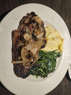 Ribeye steak.  With spinach and mashed potatoes