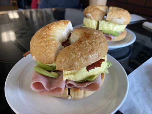 Egg Parmesan Bagel with bacon, ham, cheese and avocado.  Light and fluffy egg with a nice soft and warm bagel.