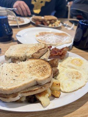 Two eggs, home fries, bacon, sausage, pancake, and toast $8.75