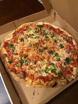 Large sausage and broccoli pizza