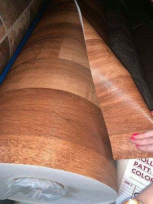 Polished wood style Vinyl $.89 cent per square foot. *Very Thick*