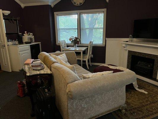 Coffee, fridge, sink, and sitting area