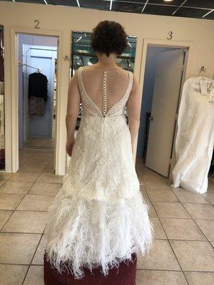 Wedding dress taken in on the sides and bustled.