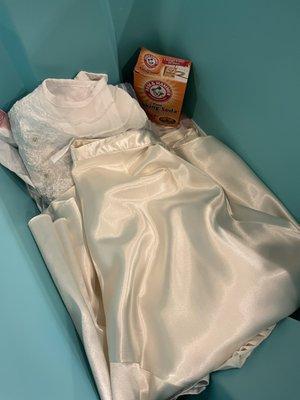 Costume in Rubbermaid bin with baking soda.