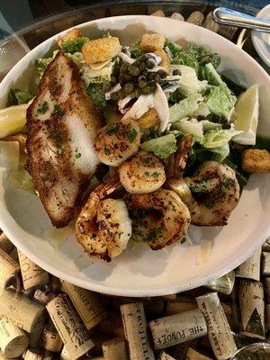 Epic Caesar salad. Topped with cod, shrimp, and scallops! A must!