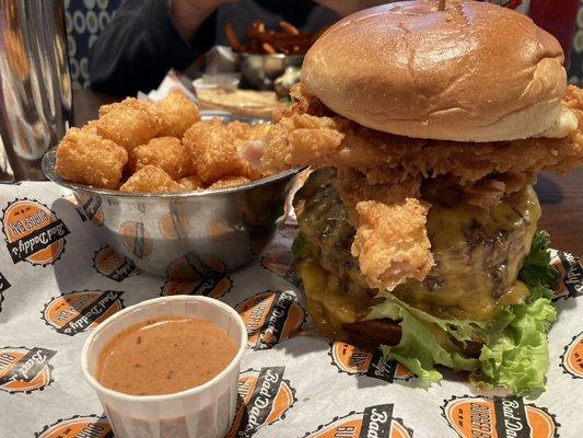 Big Daddy bad angus burger with buttermilk crisp bacon. Tater tots