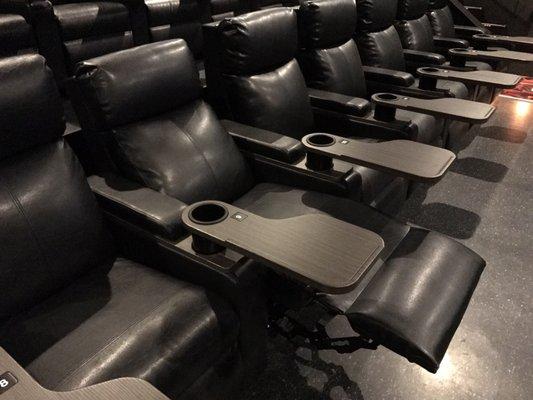 New theaters with recliner leather seats and tray tables for your food