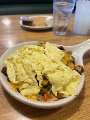 Granny Skillet-ham,sausage and bacon with mushrooms, onion, green peppers and tomatoes. Hash browns and eggs (cooked to order)