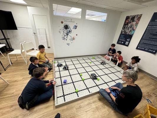 Students practice engineering robots VEX IQ in STEM classes at Magikid Highland Park Dallas