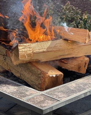 See all that WATER seeping out of our $$$ kiln dried wood! NOT kiln dried all it does is smoke! Shop elsewhere!