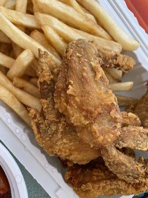 Fried chicken wings and French fries