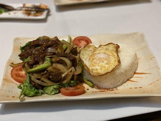 X112 Cubed Beef Steak with onions & fried egg.