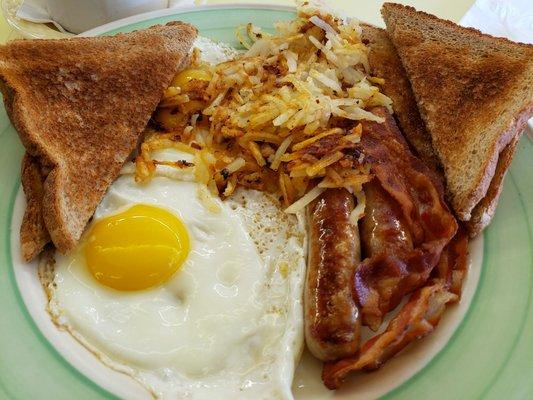 #2 sunny side eggs, half sausage half bacon, spicy hashbrowns, and wheat toast