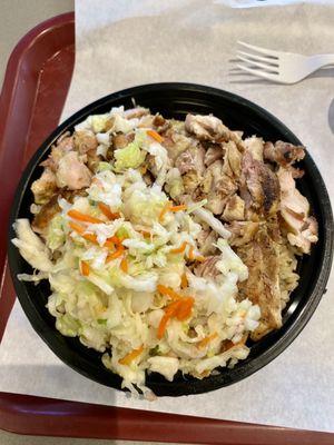 Chicken bowl with brown rice and cabbage.