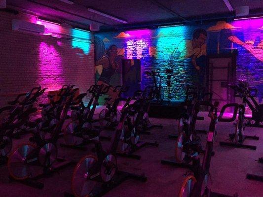 Torque Cycling studio before class with LEDs lighting their walls.