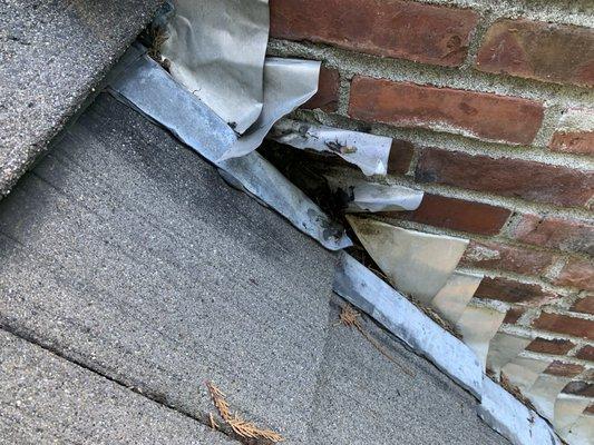 BEFORE - Deteriorated/damaged chimney flashing