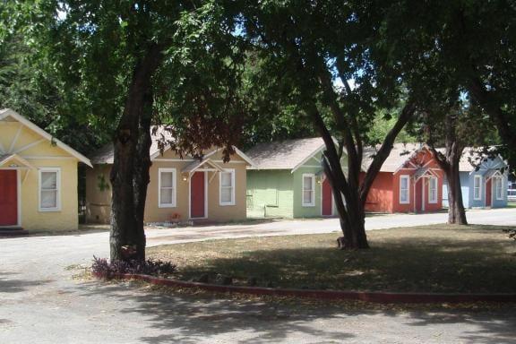 Colorfully painted cottages are 1 bedroom furnished apartments rented weekly for $189.00.