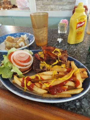 Bacon cheeseburger with fries and mashed potatoes and gravy