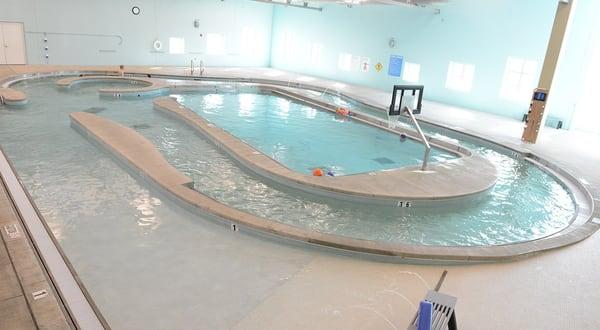 Our pool area includes a resistance walk and basketball goal.