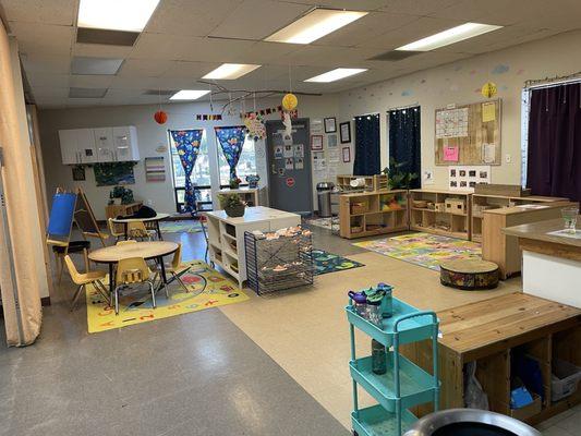 The Sunshine Classroom is designed with various stations, each offering unique opportunities for exploration and learning.