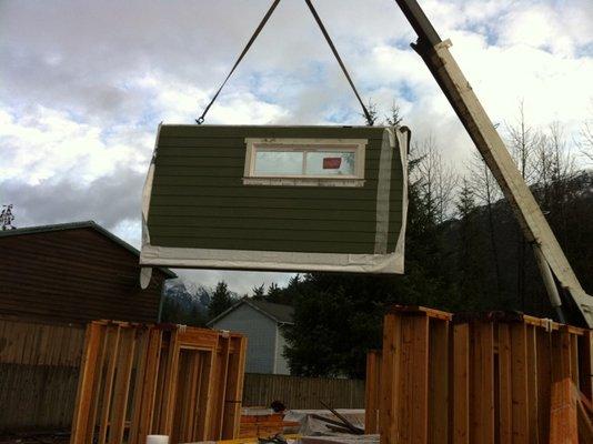 Prefabricated walls with vapor barrier, siding, & windows installed!