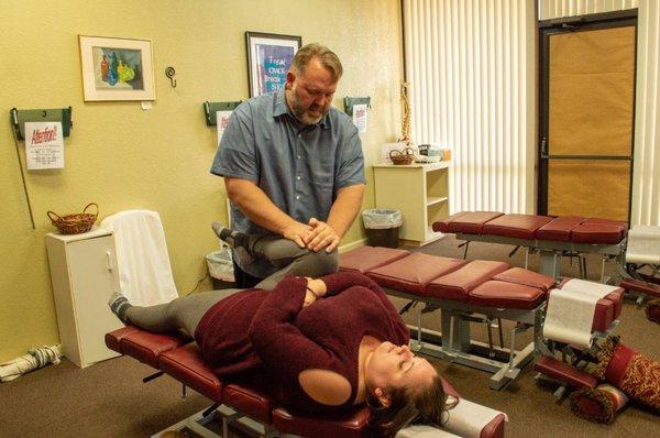 Dr Doug adjusting a patient.