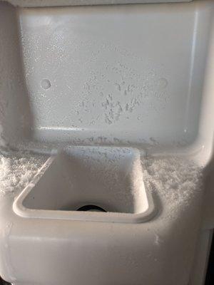 Crystals formed inside freezer at ice dispenser