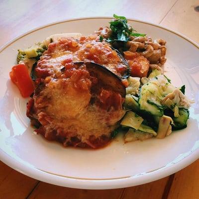 Napoli plate. Eggplant Parmesan, ribboned zucchini salad, caprese mac salad, polenta tots with a giardiniera pickle