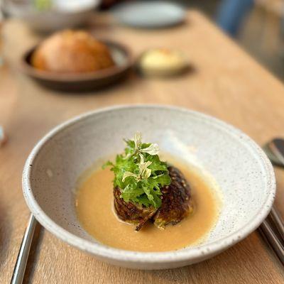 POTATO DUMPLINGS BRAISED GREENS, SESAME, POTATO SKIN BROTH