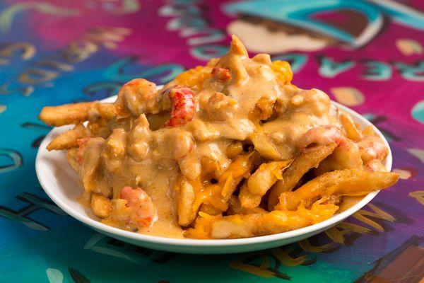 Cajun Hebert Fries Heaping portion of golden crispy fries topped with zesty crawfish mushroom cream sauce and cheddar cheese.