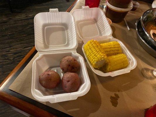 A side of potatoes and corn.