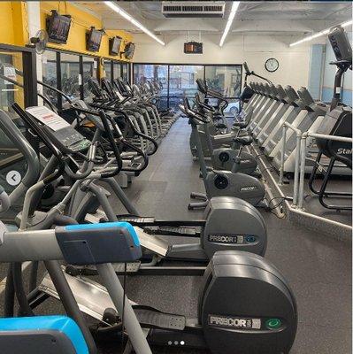 Large selection of cardio equipment for warm ups, cool downs, and aerobic conditioning on the third level of the building.