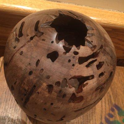 Walnut vase, all the holes were made naturally by termites. I look for natural beauty found in nature when I do a lot of my work.