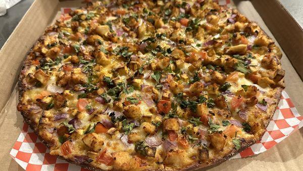 Halal Butter Chicken Pizzatwist with spicy paneer topping