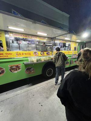 The setup of the sauces and condiments on the food truck